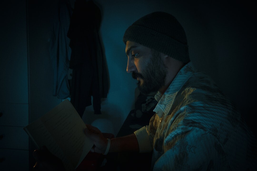 person reading book at night